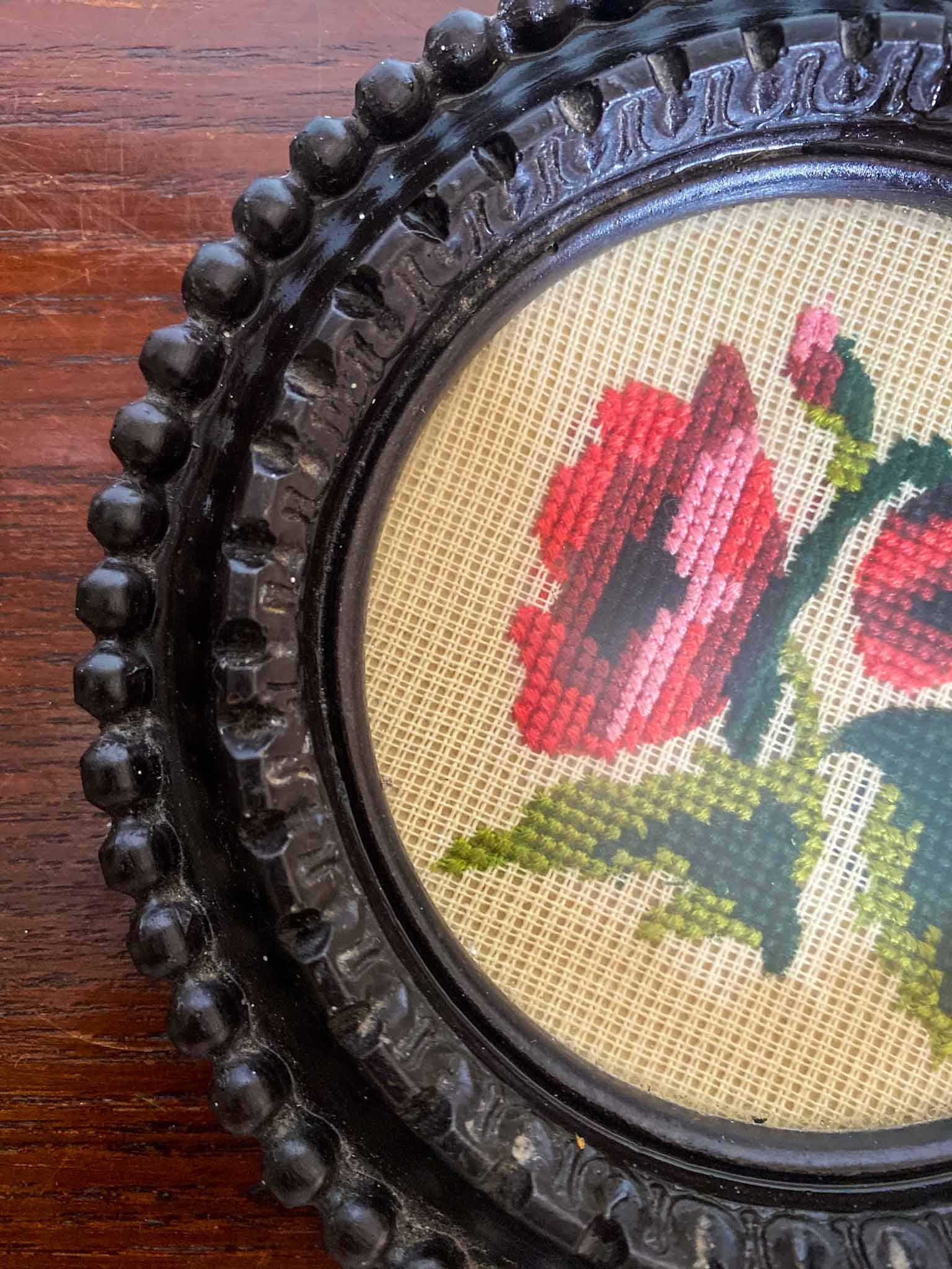 Cross-stitch roses in ebonised frame